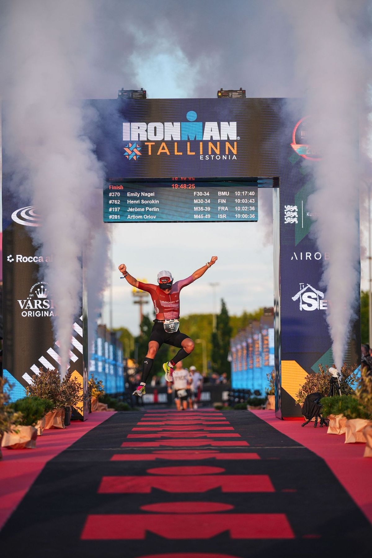 Emily Nagel crossing the finish line at Ironman Tallinn