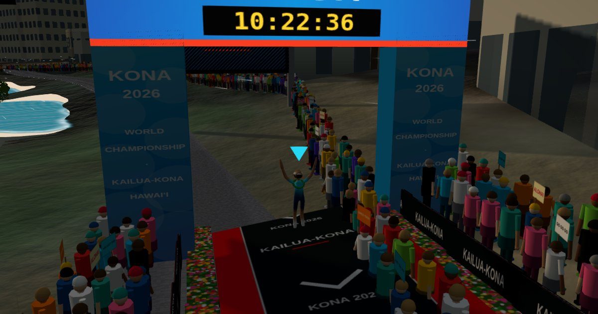 The Ali'i Drive finish: arms up under the arch with the modelled finish time.